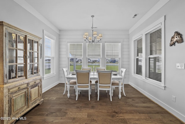 sunroom with visible vents and a chandelier