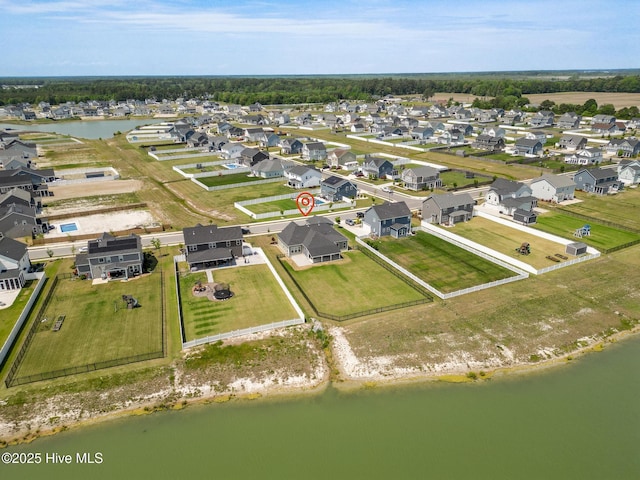 bird's eye view with a residential view and a water view