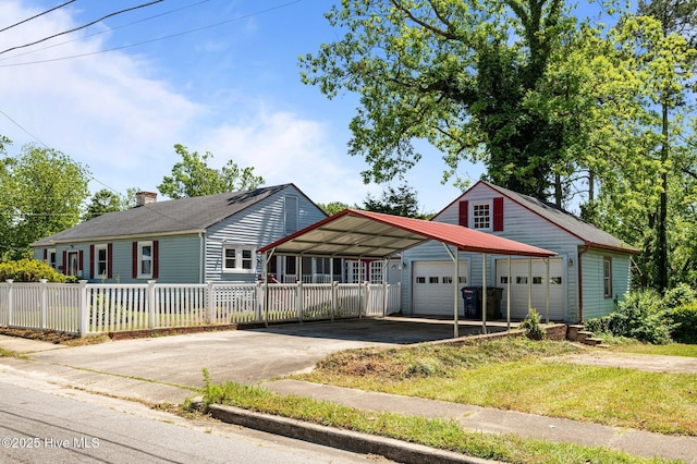 400 W Highland Ave, Kinston, NC 28501 - view of front of home featuring driveway, an outbuilding, a chimney, and a carport