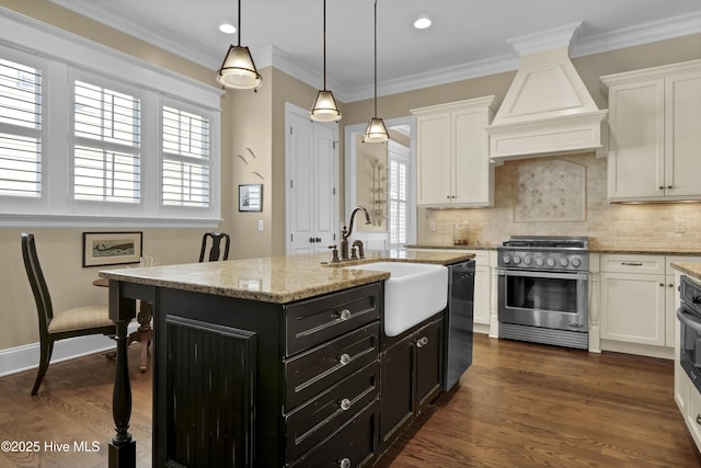 kitchen with dark cabinetry, white cabinets, custom range hood, a sink, and black appliances