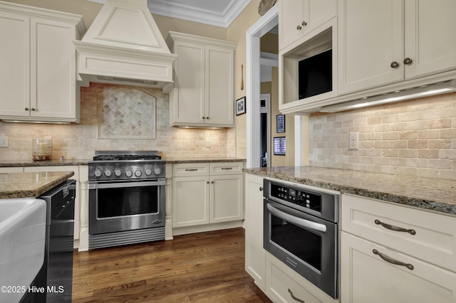 kitchen featuring premium range hood, decorative backsplash, ornamental molding, and stainless steel appliances