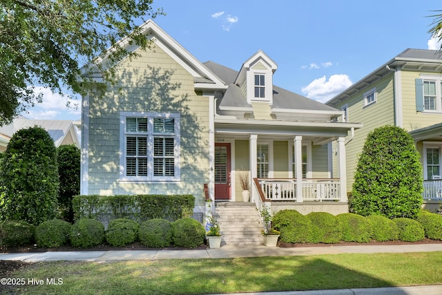 view of front of property with a porch and stairs