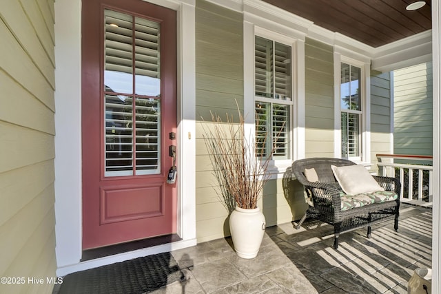 entrance to property featuring covered porch
