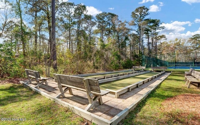 16 Myrtlewood Dr SW, Calabash, NC 28467 - view of property's community with a tennis court and fence
