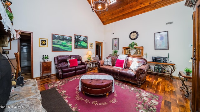 living room featuring visible vents, baseboards, high vaulted ceiling, and hardwood / wood-style flooring