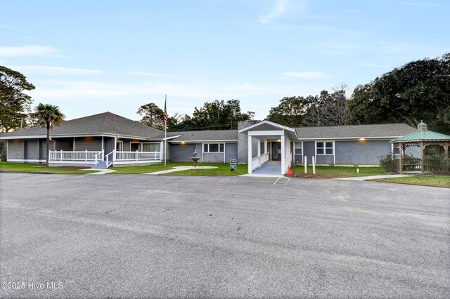 222 Rouen Ct, Wilmington, NC 28412 - community pool with fence, a patio area, and view of wooded area