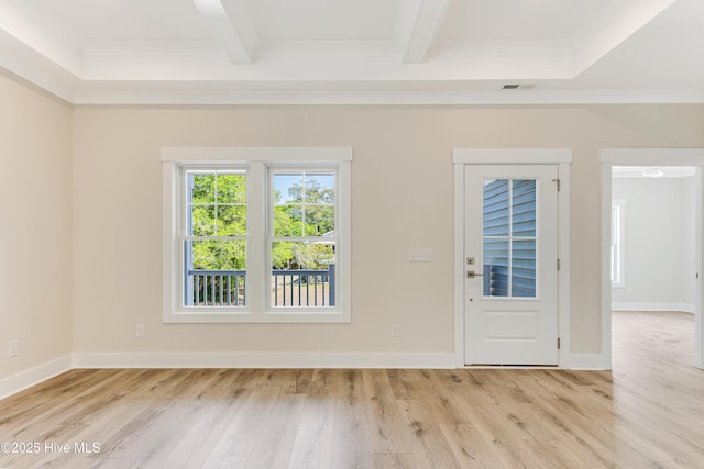interior space with baseboards, beamed ceiling, and light wood finished floors