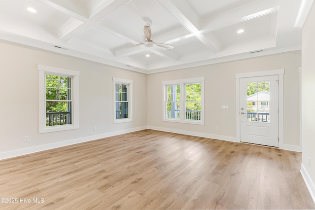 spare room with plenty of natural light, light wood-type flooring, and visible vents