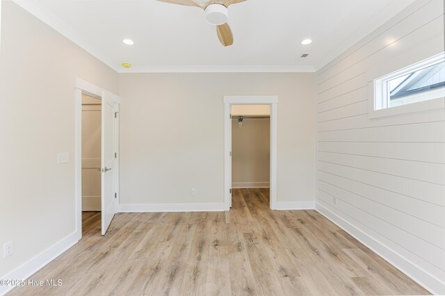 229 NE 34th St, Oak Island, NC 28465 - empty room featuring ornamental molding, light wood-type flooring, ceiling fan, recessed lighting, and wood walls