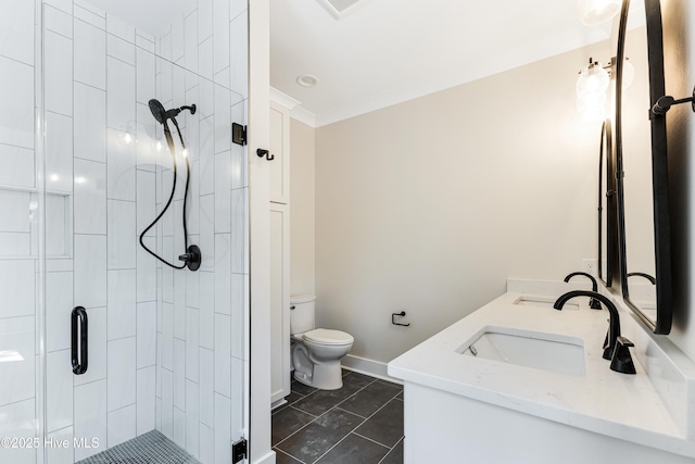 bathroom with double vanity, toilet, baseboards, a shower stall, and a sink