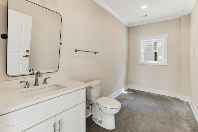229 NE 34th St, Oak Island, NC 28465 - bathroom with vanity, ornamental molding, and tile patterned flooring