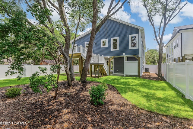 229 NE 34th St, Oak Island, NC 28465 - rear view of house with stairway and a fenced backyard