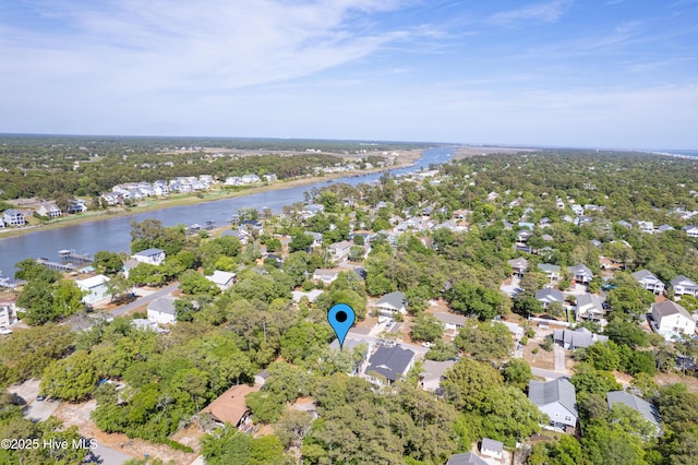 birds eye view of property with a water view and a residential view