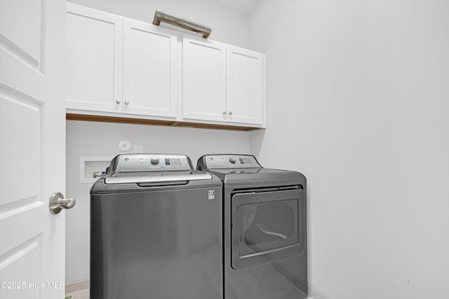 305 Ivy Ln, Carolina Beach, NC 28428 - laundry room with cabinet space and separate washer and dryer