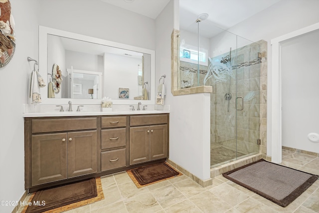 305 Ivy Ln, Carolina Beach, NC 28428 - bathroom featuring a stall shower, double vanity, and baseboards