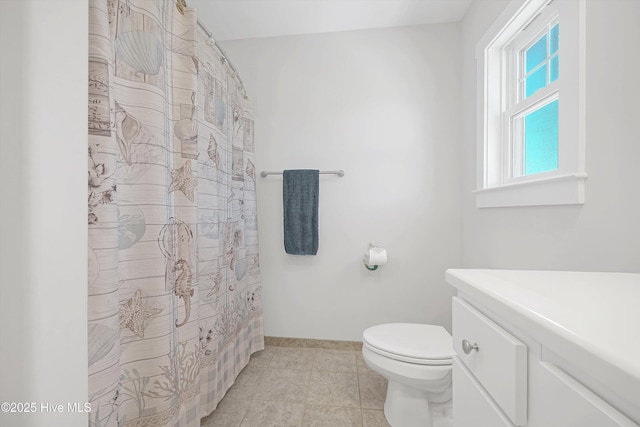 305 Ivy Ln, Carolina Beach, NC 28428 - full bath with toilet, tile patterned flooring, and curtained shower