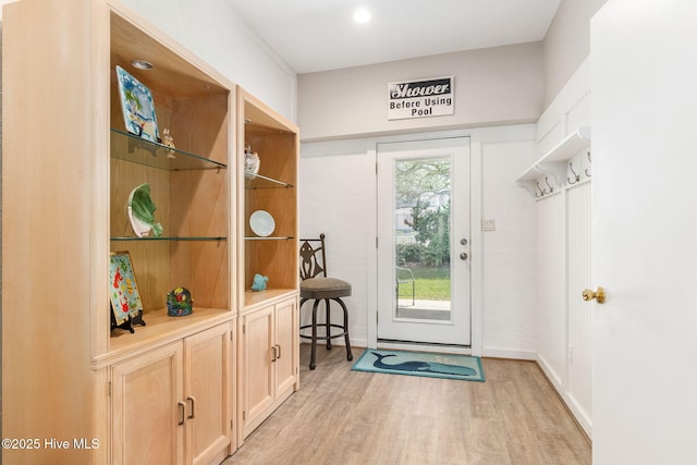 doorway to outside with light wood-type flooring