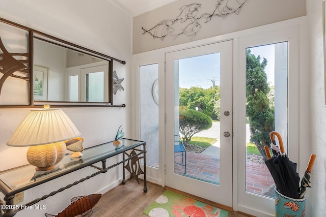 doorway to outside featuring wood finished floors