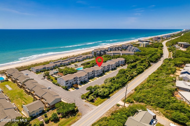bird's eye view featuring a water view and a view of the beach