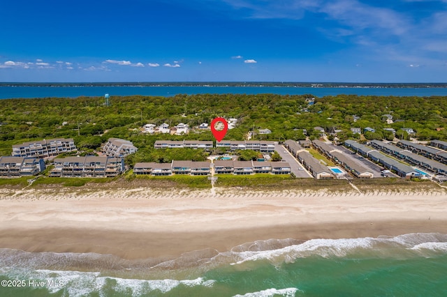 bird's eye view featuring a water view and a beach view