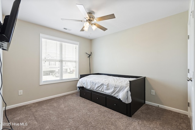 507 Romper Rd, Sneads Ferry, NC 28460 - carpeted bedroom featuring baseboards, visible vents, and ceiling fan