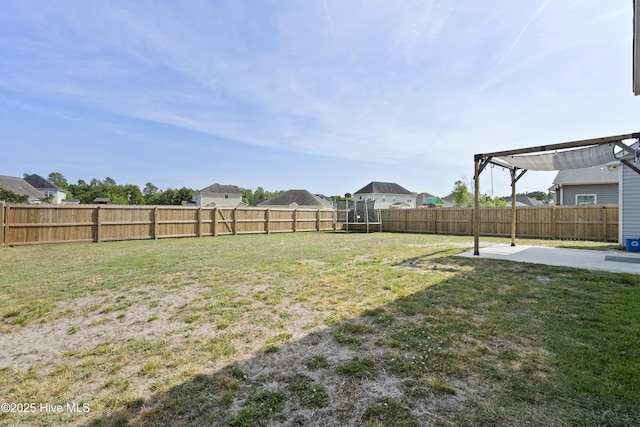 507 Romper Rd, Sneads Ferry, NC 28460 - view of yard featuring a patio, a fenced backyard, a trampoline, and a pergola