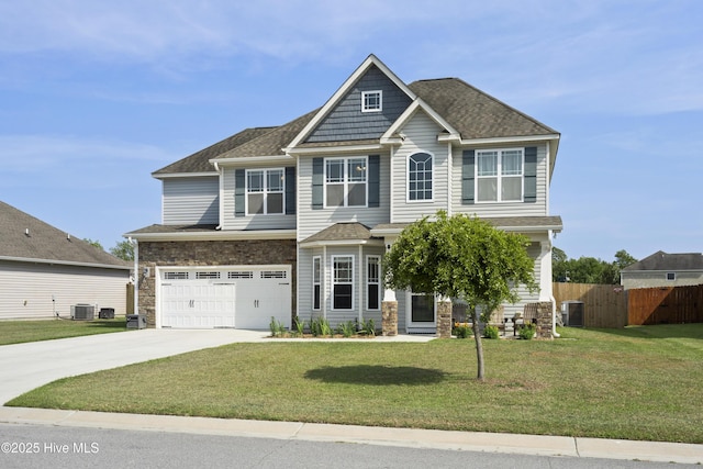 507 Romper Rd, Sneads Ferry, NC 28460 - craftsman-style house featuring an attached garage, fence, driveway, and stone siding