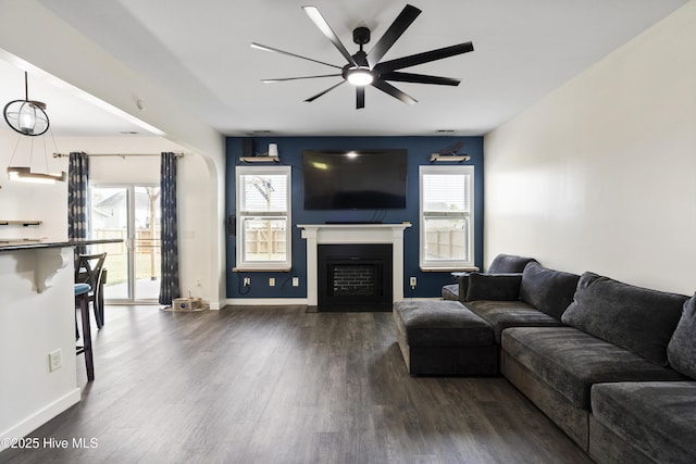 507 Romper Rd, Sneads Ferry, NC 28460 - living room with a ceiling fan, baseboards, dark wood-style floors, and a fireplace