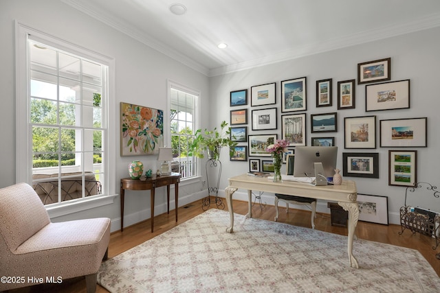 office area featuring crown molding, recessed lighting, baseboards, and wood finished floors