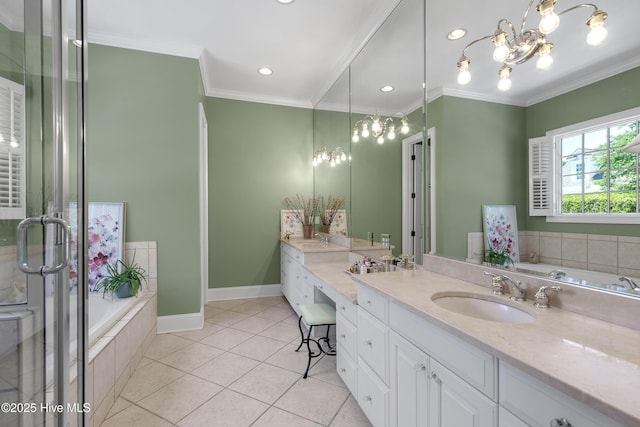full bathroom with a sink, a bath, tile patterned flooring, and double vanity