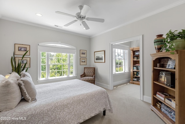 bedroom featuring carpet flooring, baseboards, multiple windows, and ornamental molding