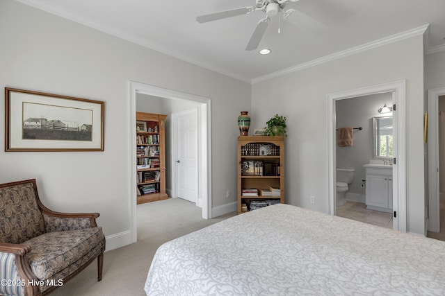 bedroom with crown molding, recessed lighting, ensuite bathroom, and light colored carpet