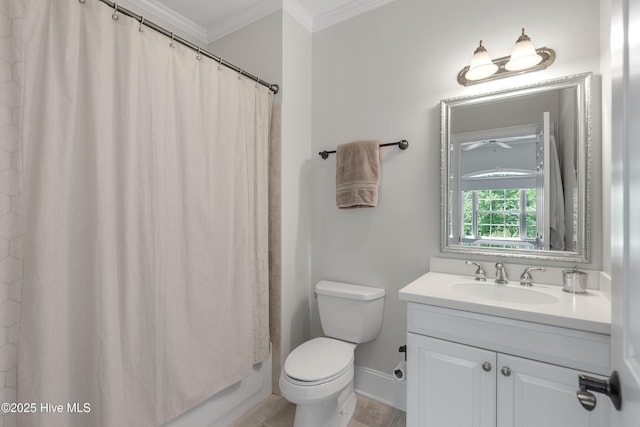 bathroom featuring vanity, ornamental molding, tile patterned flooring, toilet, and baseboards