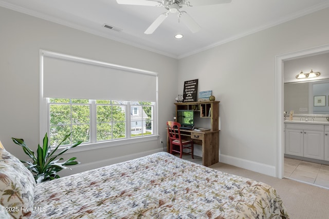 bedroom featuring visible vents, ornamental molding, light carpet, baseboards, and a sink