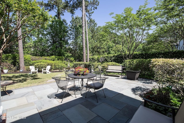 view of patio featuring outdoor dining area