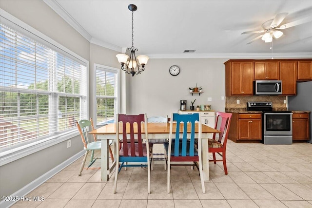 dining area featuring visible vents, crown molding, baseboards, ceiling fan with notable chandelier, and light tile patterned floors