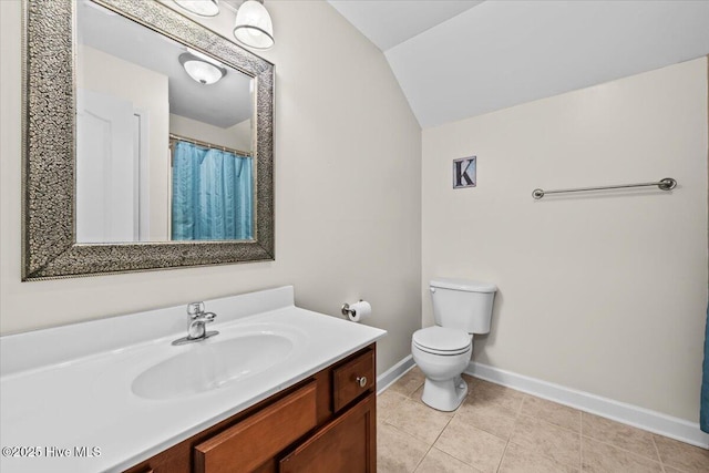 full bath with baseboards, tile patterned floors, vanity, toilet, and lofted ceiling
