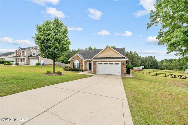 craftsman-style home with a garage, a front lawn, fence, and driveway