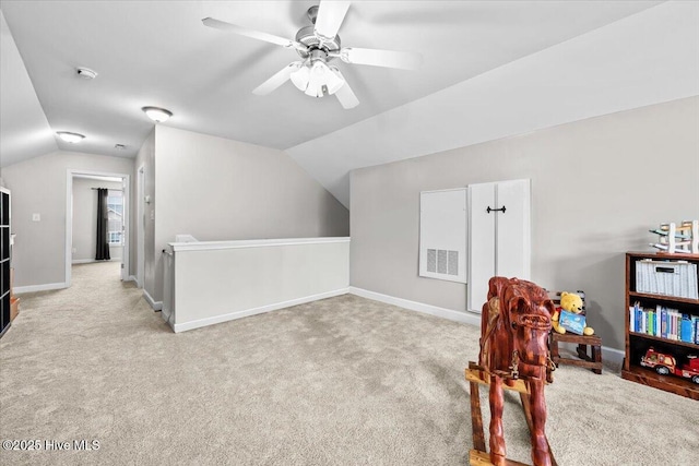 interior space with carpet floors, visible vents, ceiling fan, and lofted ceiling