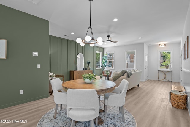 dining room featuring a notable chandelier, light wood finished floors, recessed lighting, baseboards, and visible vents
