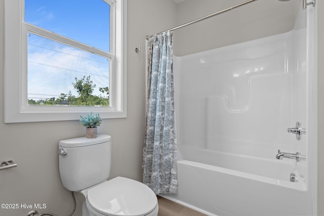 full bathroom with shower / bath combo and toilet