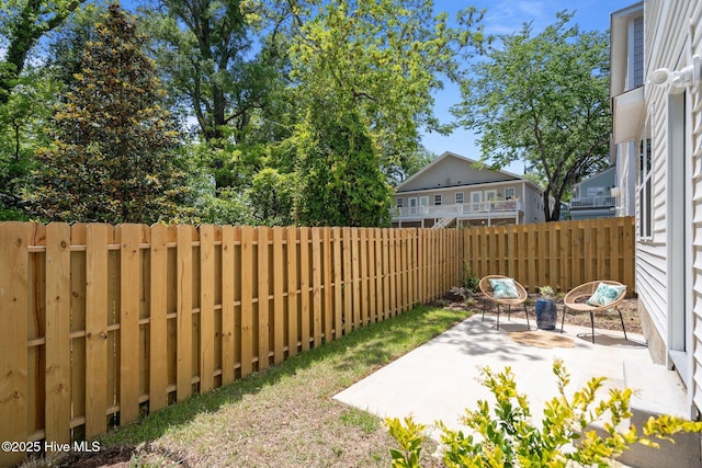 view of yard with a patio and a fenced backyard