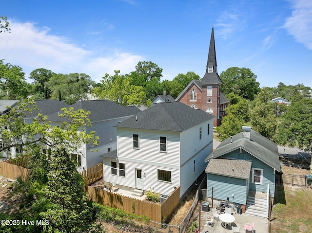 back of property featuring a patio and a fenced backyard