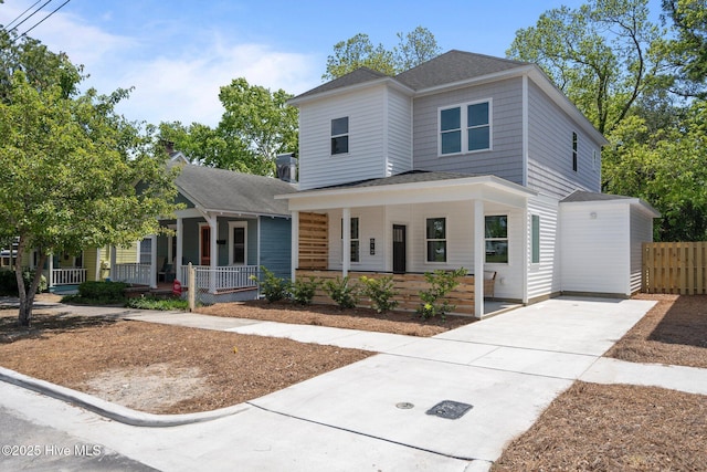view of front of house with a porch and roof with shingles