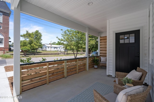 view of patio featuring a porch
