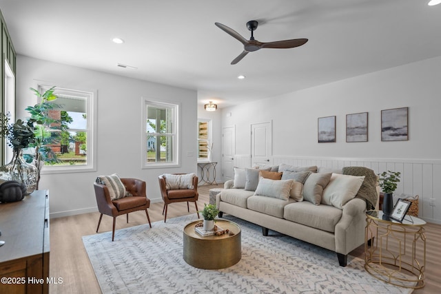 living area featuring recessed lighting, a ceiling fan, wood finished floors, and visible vents