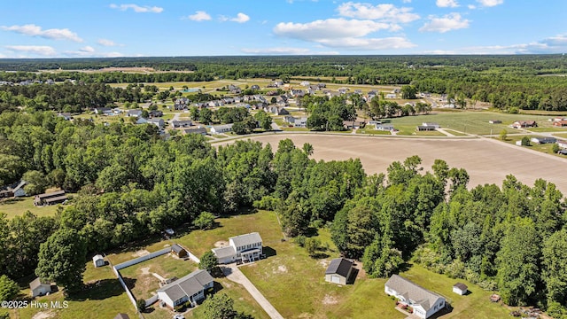 bird's eye view with a forest view and a residential view