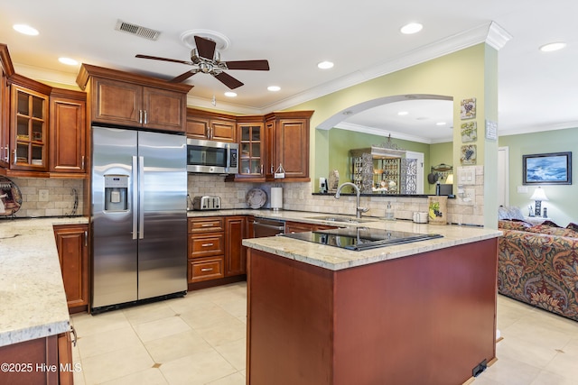 121 NW 1st St, Oak Island, NC 28465 - kitchen featuring crown molding, ceiling fan, a sink, appliances with stainless steel finishes, and backsplash