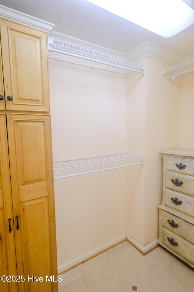 121 NW 1st St, Oak Island, NC 28465 - spacious closet featuring light tile patterned flooring
