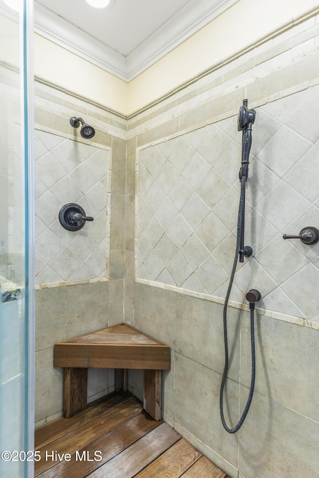 121 NW 1st St, Oak Island, NC 28465 - full bathroom with a tile shower and ornamental molding
